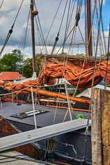 Details of a historic sailing boat anchored in the port of the hanseatic city of Greifswald in...