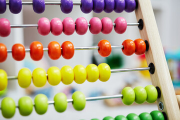 children's multicolored abacus toy on saint background