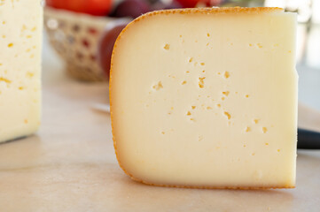 Cheese collection, French fol epi  cheese with many little holes, etorki, tomme noire des pyrenees and ossau iraty cheese