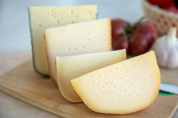 Cheese collection, French fol epi  cheese with many little holes, etorki, tomme noire des pyrenees and ossau iraty cheese