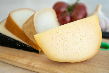 Cheese collection, French fol epi  cheese with many little holes, etorki, tomme noire des pyrenees and ossau iraty cheese