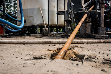 Low angle view of Horizontal directional drilling technology. Drilling machine work process....