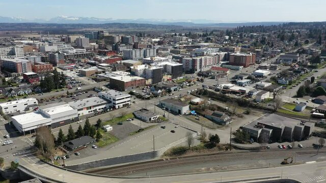 Cinematic aerial drone clip of downtown Everett, Bayside, Port Gardner, Naval Station Everett suburbs, bedroom communities North of Seattle on the shores of Puget Sound in Washington