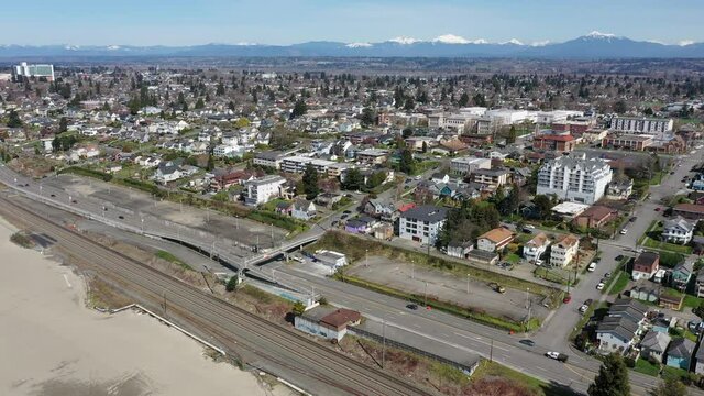 Cinematic aerial drone clip of downtown Everett, Bayside, Port Gardner, Naval Station Everett suburbs, bedroom communities North of Seattle on the shores of Puget Sound in Washington