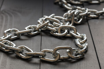 close-up of a steel chain perspective receding into the distance