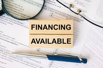 Wooden blocks with text Financing Available on financial docs