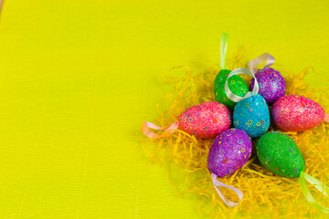 Quail eggs and easter decoration on yellow background with, easter background