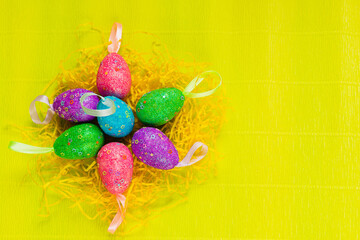 colorful, hand-painted, pastel Easter eggs on a bright, yellow, spring background.colorful, hand-painted, pastel Easter eggs on a bright, yellow, spring background