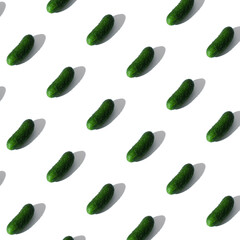 pattern of lying cucumbers on a white background