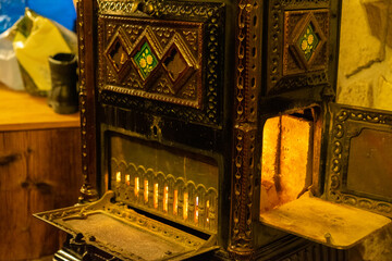 Making a fire in an old oven, Kachelofen.