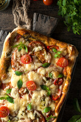 square pizza with tomatoes and cheese