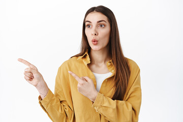 Wow thats interseting. Curious female customer seeing cool new promo deal, pointing and looking...
