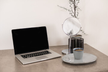 Coffee cup and laptop for business. laptop on the coffee table