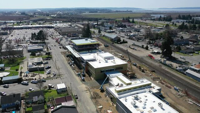 Cinematic aerial drone clip of downtown Marysville, by the I-5 freeway, a distant suburb, bedroom community North of Seattle on the shores of Puget Sound in Washington