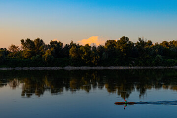 Fototapeta na wymiar Po river kayaking at italian sunset summer