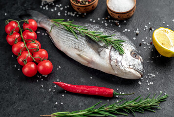 raw dorado fish on stone background