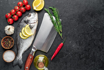 raw dorado fish on stone background with copy space for your text