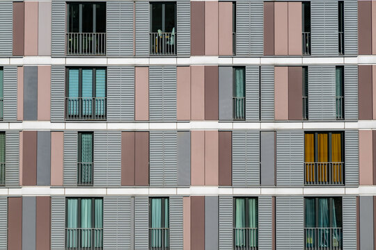 Abstract concept of building facade detail with panoramic windows. Architectural background. Frontal view of multi-storey building. Aerial view of skyscrapers with repetitive texture in facade