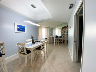 A beach themed  Dining Room in a Condominium complex in Florida.