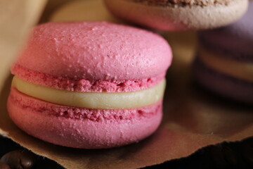 macaroon stuffed with a very close-up of pink brown coffee chocolate lilac dessert of French cuisine
