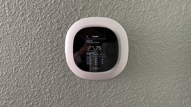 An Ecobee Smart Thermostat In A Home.