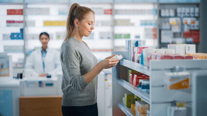 Pharmacy Drugstore: Beautiful Caucasian Young Woman Chooses to Buy Medicine, Drugs, Vitamins,...