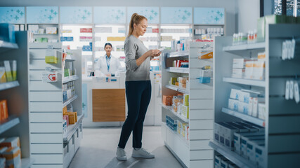 Pharmacy Drugstore: Beautiful Young Woman Chooses to Buy Medicine, Drugs, Vitamins, Searches for the Best Choice. Checkout Counter Serves Customers. Shelves with Health Care, Beauty Products