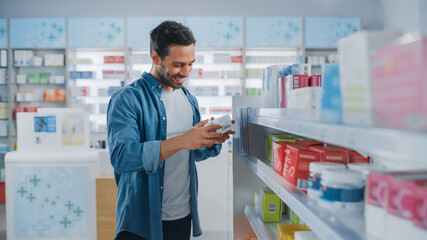 Pharmacy Drugstore: Portrait of Handsome Latin Man Choosing to Buy Medicine Browsing through the...