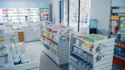 Foto op Canvas Big Modern Pharmacy Drugstore with Shelves full of Packages Full of Modern Medicine, Drugs, Vitamin Boxes, Pills, Supplements, Health Care Products. Pharmacist Standing at Counter. © Gorodenkoff