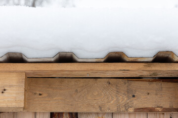 Snow on the roof with corrugated iron sheet