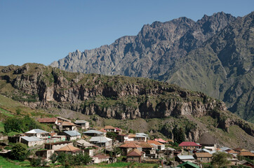 Mountain village Stephantsminda on the background of the mountain range in Georgia