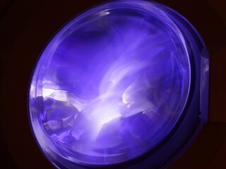 Circle blue white glass door purple lighting in dark, abstract round blue circle shape