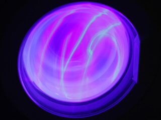 Illuminator round glass pink blue lighting in dark, abstract round blue circle neon shape