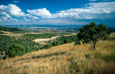 Fototapeta na wymiar Vast landscape, valley with highway, rock formations and reservoir, Utah