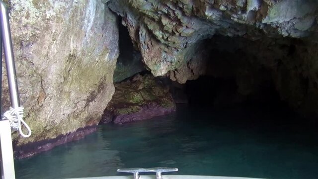 Impressive large grotto in the cliff along Palunuro coastline. Italy.