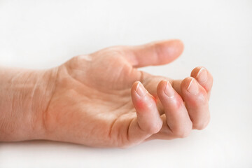 Sick female fingers of an elderly man's hand on a white background