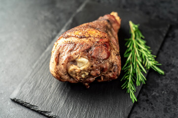 Leg of lamb baked in the oven on a stone background