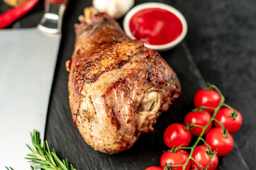 Baked turkey, turkey leg with rosemary on a stone background 
