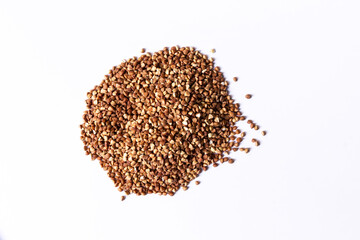 Buckwheat grain fon white background.