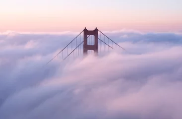 Stickers pour porte Pont du Golden Gate Golden Gate Bridge covered in clouds during the sunset in the evening in California