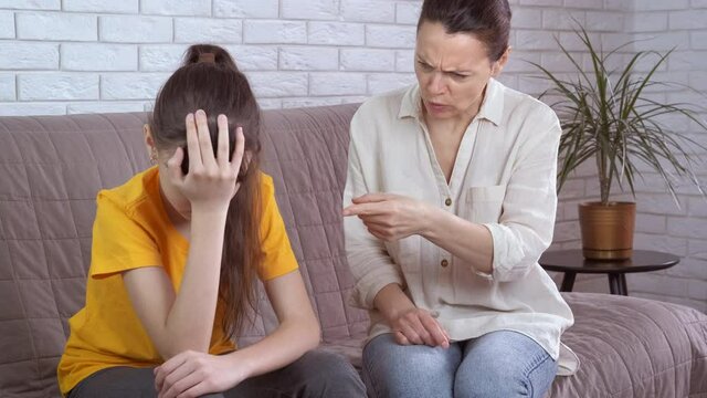 Mother scolds her daughter. Mom yells at the teenage daughter. Problems in a family with a teenager.