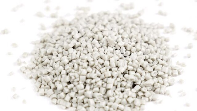 Secondary granule made of polypropylene, white plastic pellets crumbles on isolated background. Plastic raw materials in granules for industry. Polymer resin. Raw plastic recycling concept