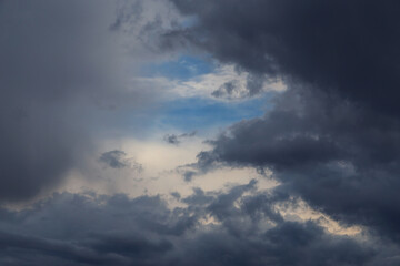 Fototapeta na wymiar Epic Dramatic Storm sky, dark gray fluffy cumulus clouds background texture, thunderstorm