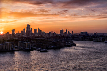 Naklejka premium Wide panoramic view to the skyline of London along the river Thames, United Kingdom, during sunset time