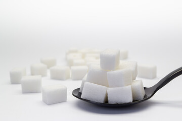 Heap of refined white sugar in a spoon