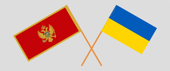 Crossed flags of Montenegro and Ukraine. Official colors. Correct proportion