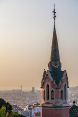 Barcelona, Spain. Tower with the spire and vane on the roof of the Gaudí House Museum. This is the...