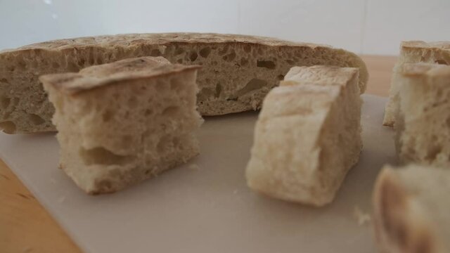 Close-up on pieces of traditional bread from Madeira called bolo do caco. Handheld shot