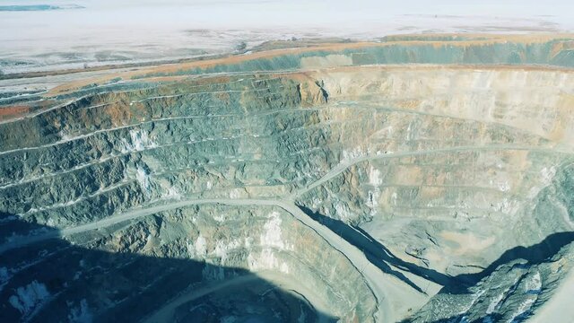 Open quarry, mining industry concept. Landscape with a massive mine pit