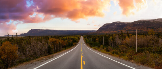 Scenic highway during a vibrant sunny day in the fall season. Dramatic Sunrise Sky Art Render....
